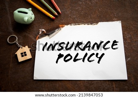 Insurance Policy concept. Burning sheet of paper with text.
