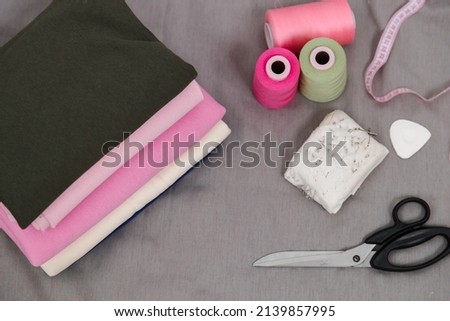 fabrics in folded rolls on a white background