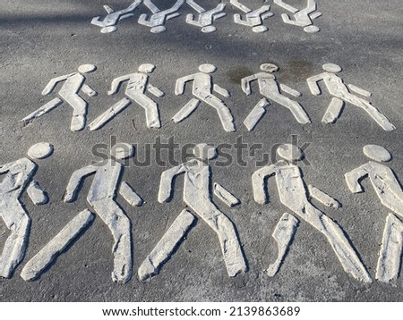 pedestrian crossing. the symbol of crossing the road. painted little men