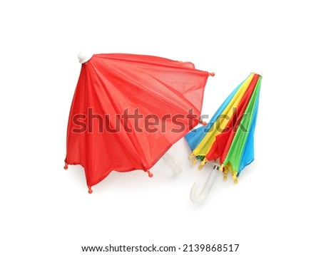 Two colorful umbrellas on white background