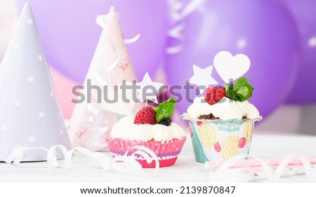 Two beautiful cakes on the background of balloons. Image with selective focus