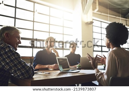 Its about making ideas happen. Shot of a group of colleagues having an office meeting inside. Royalty-Free Stock Photo #2139873807