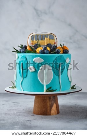Children's cake for a boy with a car and clouds.