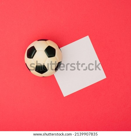 Football and soccer Square leaflet mock up blank template design idea. Black and white soccer ball mockup against pastel pink background. Copy space templates designs for message layout.