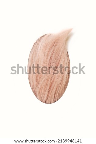 Unique easter minimal concept. Abstract baby pink colored fluffy filled with one part out of it,  egg shaped, against off-white background.
