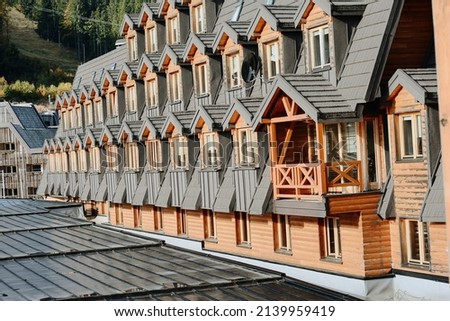 bosnia and herzegovina jahorina,dinar alps wooden building style, typical  hotel architecture, old rustic wood covered with snow in winter