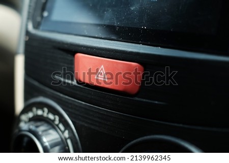 Emergency stop button icon on car dashboard