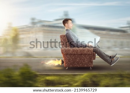 Funny person with a laptop computer having a performance boost Royalty-Free Stock Photo #2139965729