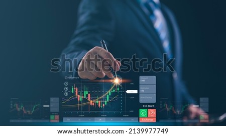 planning analyze indicator and strategy buy and sell, Stock market, Business growth, progress or success concept. Businessman or trader is pointing a growing virtual hologram stock, invest in trading
 Royalty-Free Stock Photo #2139977749