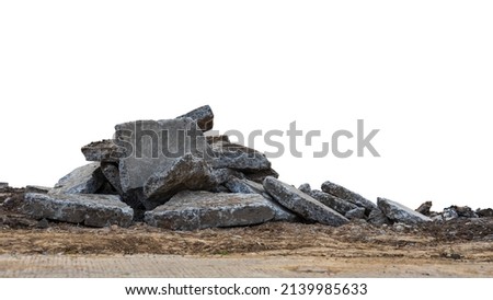 Low View Isolate Debris of large concrete blocks are piled up on the mounds of road demolition for renovations, which are common during the summer in rural Thailand. Royalty-Free Stock Photo #2139985633