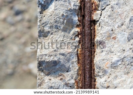 Old reinforced concrete structure with damaged and rusty metallic reinforcement that must be demolished - Metal bars rusty due to water infiltration into concrete  Royalty-Free Stock Photo #2139989141