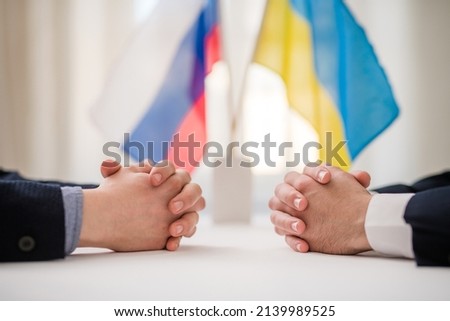 Diplomatic negotiation between Ruassia and Ukraine, Ukrainian war concept. Royalty-Free Stock Photo #2139989525