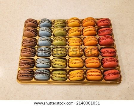 Macaron is a sweet meringue-based confection made with egg white, icing sugar, granulated sugar, almond meal, and food colouring.