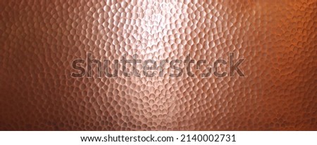 A Shiny Hammered Copper Texture Royalty-Free Stock Photo #2140002731