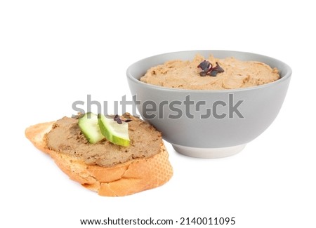 Fresh bread and bowl with delicious liver pate on white background