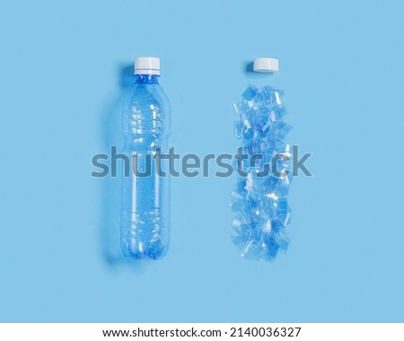 Blue plastic bottle whole and destruction on blue background. Plastic pollution concept, global ocean pollution ecology problem, use non-biodegradable plastic, environmental impact on nature, top view Royalty-Free Stock Photo #2140036327