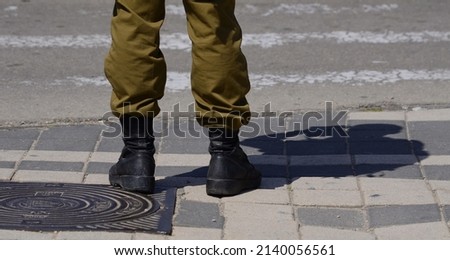 Soldier's boots on the feet of an Israeli soldier. Concept: Soldiers IDF - Israel Defense Forces (Tzahal), IsraelI soldiers, Israeli army Royalty-Free Stock Photo #2140056561