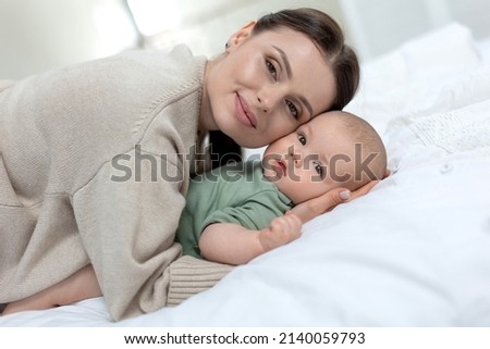 A woman with a small child. Mom with a baby. High quality photo