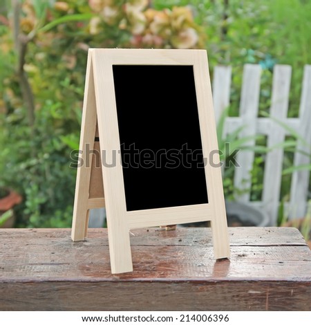 empty Wooden black board (menu board) at a coffee Shop