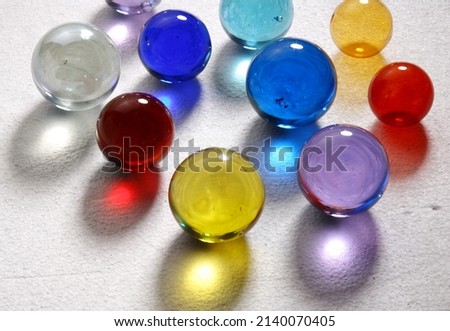 close-up colored glass marbles, balls, marbles on a white background