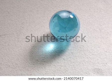 blue glass marble, ball, marble on a white background
