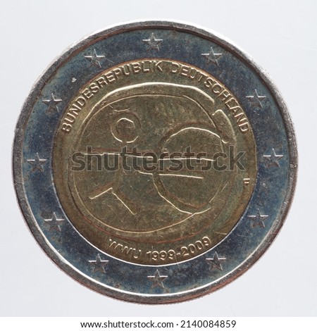 Germany - circa 2009: a 2 Euro coin of Germany with a human symbol and a Euro sign. 10 years Economic and Monetary Union EMU
