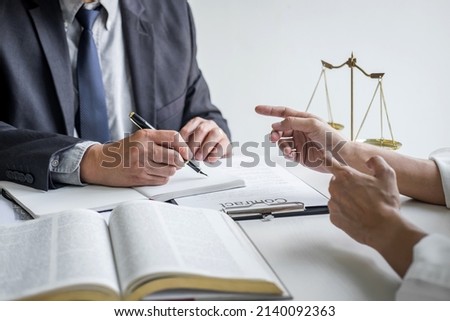 Good service cooperation, Consultation of Businesswoman and Male lawyer or judge counselor having team meeting with client, Law and Legal services concept. Royalty-Free Stock Photo #2140092363