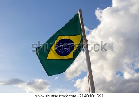 Brazilian flag flying in the wind. Translation: order and progress.