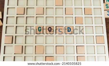 A word GOLD made of wooden alphabet letters vocabulary game . High quality photo
