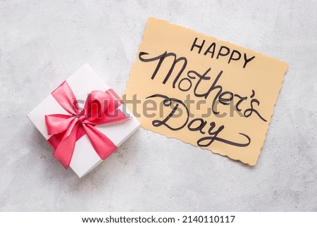 Happy Mothers day greeting card with gift box pink ribbon