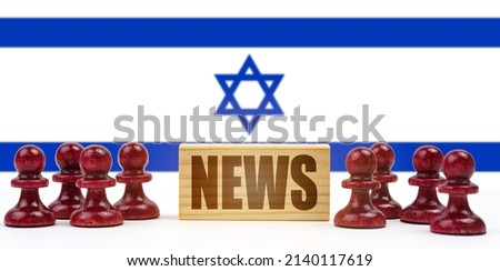 National concept. Against the background of the flag of Israel, pawns and a sign with the inscription - news