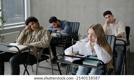 Young students employees workers unmotivated staff sitting in classroom listening boring lecture tedious coach teacher at corporate seminar bored participants fall asleep overloaded with information Royalty-Free Stock Photo #2140118587