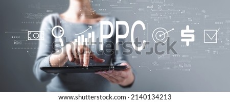 PPC - Pay per click concept with business woman using a tablet computer