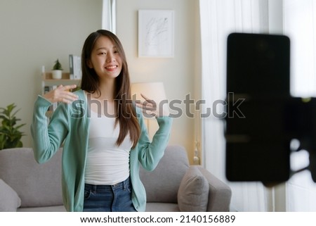 Asian young woman er created her dancing video by smartphone camera To share video to social media application Royalty-Free Stock Photo #2140156889