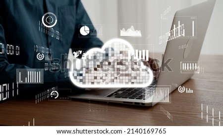 Businessman uses capable laptop computer to connect to cloud computing network for team data sharing on the cloud server and access computer files