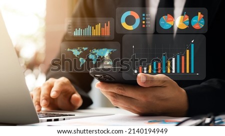 Businessman showing a virtual screen, analysis of business growth and investment graphs, strategic planning to increase sales profits, long-term planning. Royalty-Free Stock Photo #2140194949