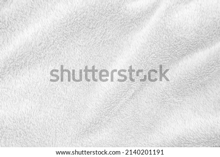 White clean wool texture background. light natural sheep wool. white seamless cotton. texture of fluffy fur for designers. close-up fragment white wool carpet..	