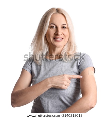Mature woman with applied nicotine patch on white background. Smoking cessation Royalty-Free Stock Photo #2140215015