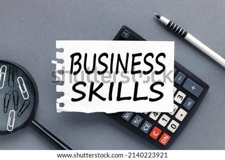 business skill text on paper on black calculator