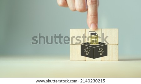 Suggestion and feedback concept. New idea, solution. Wooden cubes with suggestion box, card holder icon on grey background. Business review, strategy suggestion, comment for business developement. Royalty-Free Stock Photo #2140230215