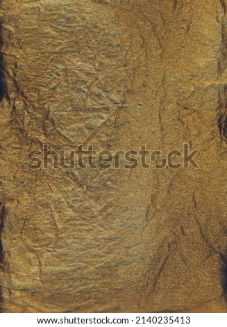 Wrinkled effect fabric texture. Gold crumpled background