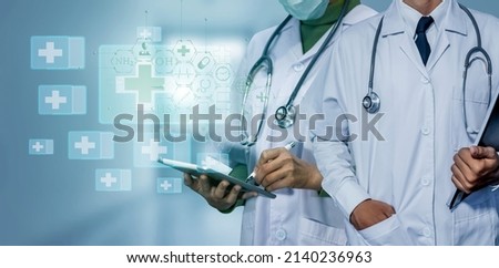 Medicine doctor touching on tablet and digital healthcare and network connection with modern virtual screen interface icons on the hospital background, Medical technology and network concept.