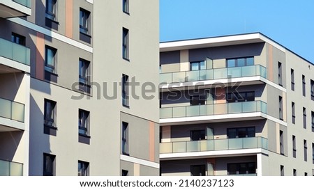 Modern european residential architecture on a sunny day. Exterior of new multi-story residential building. Concept of sale and rental of apartments for  consumers .Modern windows and balconies. Royalty-Free Stock Photo #2140237123