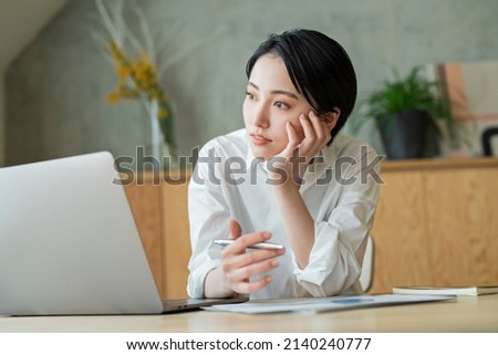 Young women working at home Royalty-Free Stock Photo #2140240777