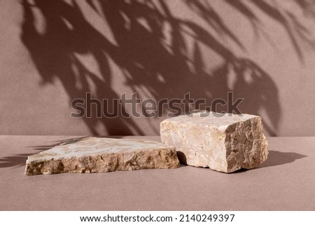 Podiums for cosmetic product presentation. Abstract minimal geometrical form. Natural beige stone two form, shadow. Scene to show products. Showcase, display. Trendy sunlight. Front view. 3D.
