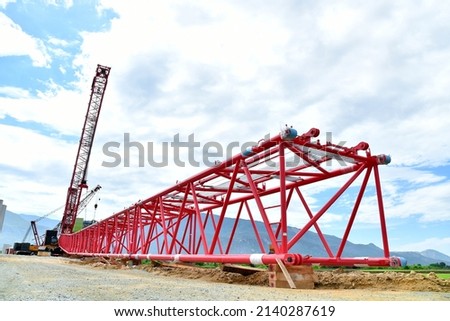 Machine, crawler crane at construction site on blue sky background | assembling a crane for construction works
