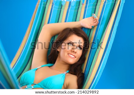 Beautiful Young Woman relaxing in hammock