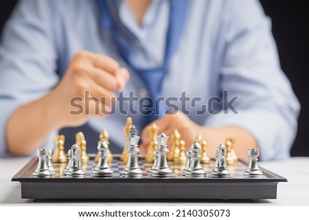 Businessman playing with chess game. Business strategy ideas and investment. Close-up photo
