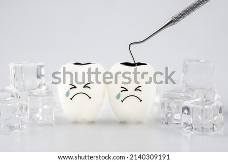Tooth decay sensitive is crying with cold ice on white background ,Dental concept of tooth sensitivity from drinking cold water