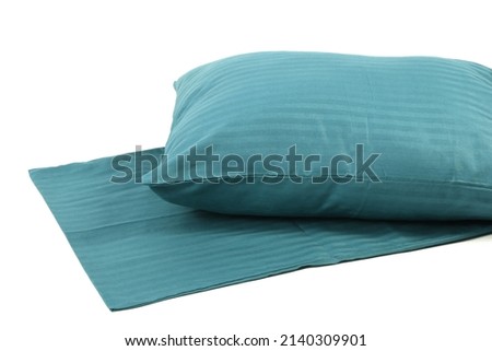 Corner of a soft pillow in a new colored cotton fiber pillowcase. Satin stripe material to protect and decorate the pillow. Bed linen for home and hotels Royalty-Free Stock Photo #2140309901